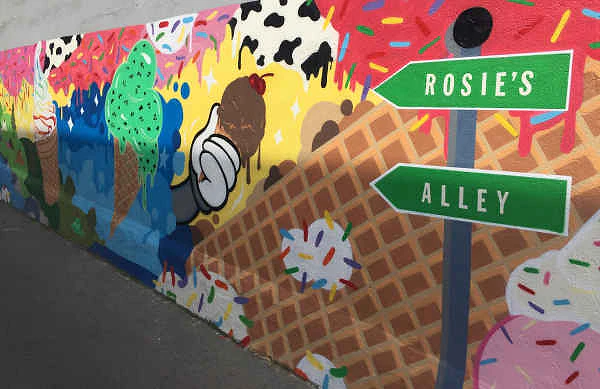 Colorful Rosie's Alley mural painted with ice cream, sprinkles, and waffle cones