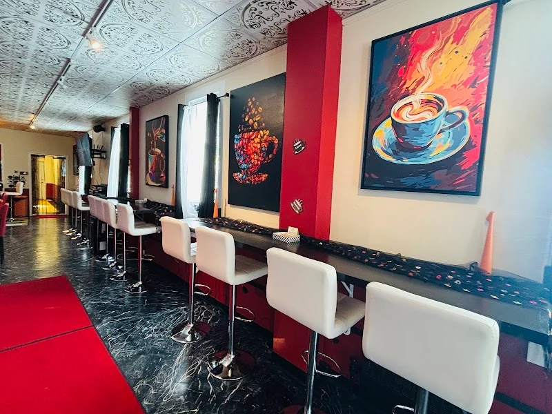 Rosie's counter seats with cafe art and red columns