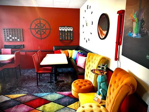 Colorful seating and game area inside Rosie's