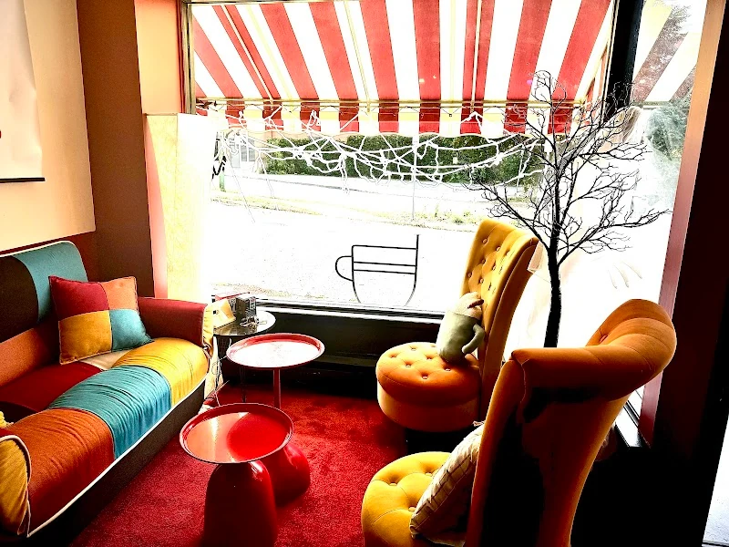 Colorful lounge seating by the front window at Rosie's